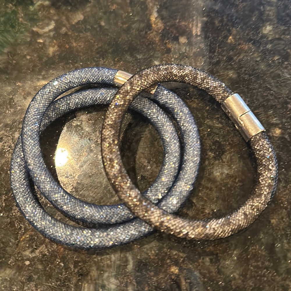 Two, beautiful bracelets. In great condition. Some scratches on clasp.